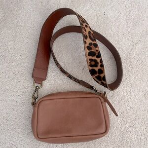 Brown leather crossbody bag with animal print strap